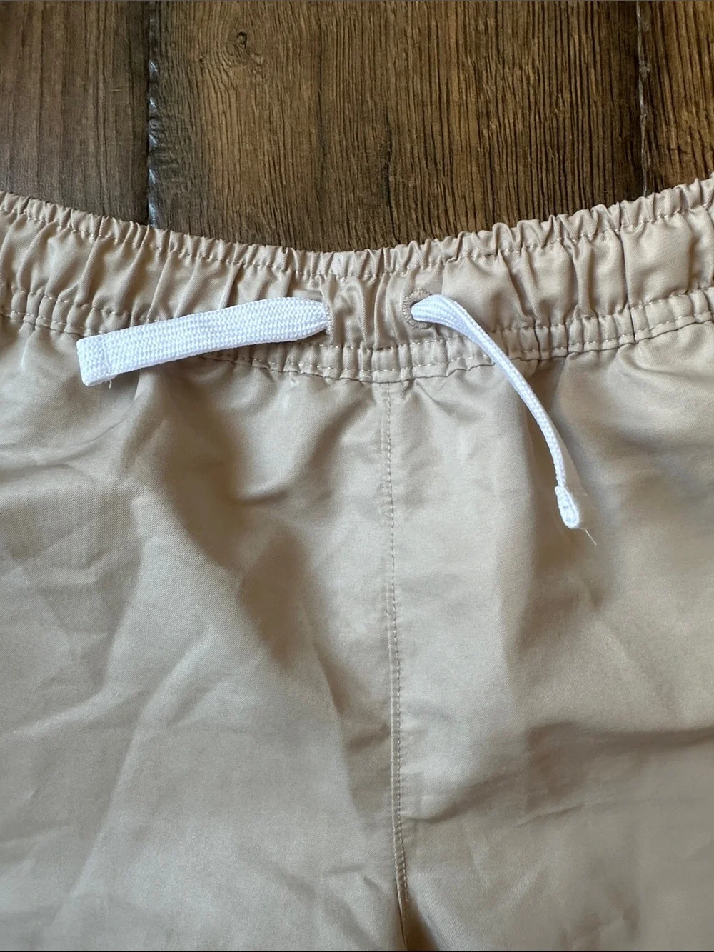 Nike Kids Beige Elastic Waist Shorts with White Drawstring